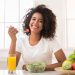 Fresh foods on a plate with a toothbrush, representing a healthy diet for strong teeth