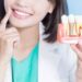Close-up image of a smiling patient showing natural-looking dental implants fitted by a Dentist in Ealing