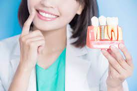 Close-up image of a smiling patient showing natural-looking dental implants fitted by a Dentist in Ealing