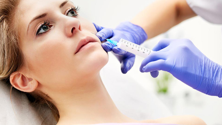 Woman receiving dermal filler treatment at a private dentist in Ealing to restore facial volume and reduce wrinkles